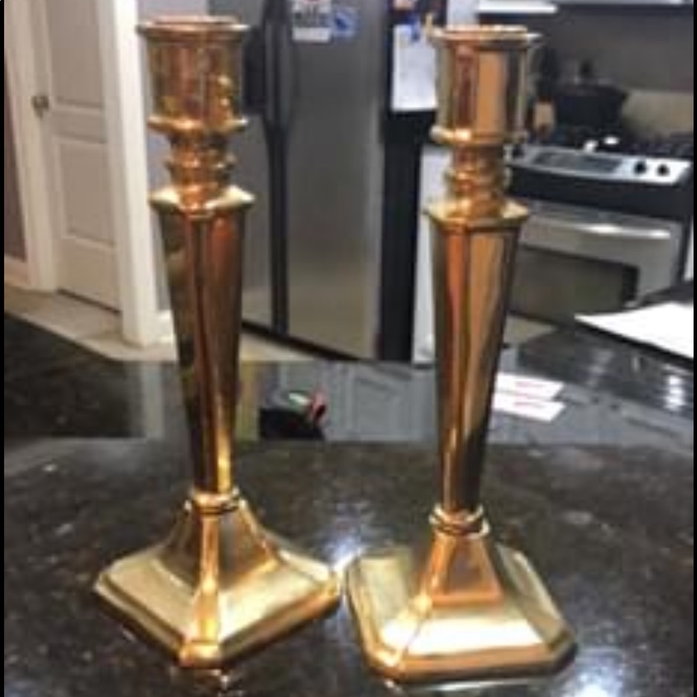 Two gold candle holders very heavy